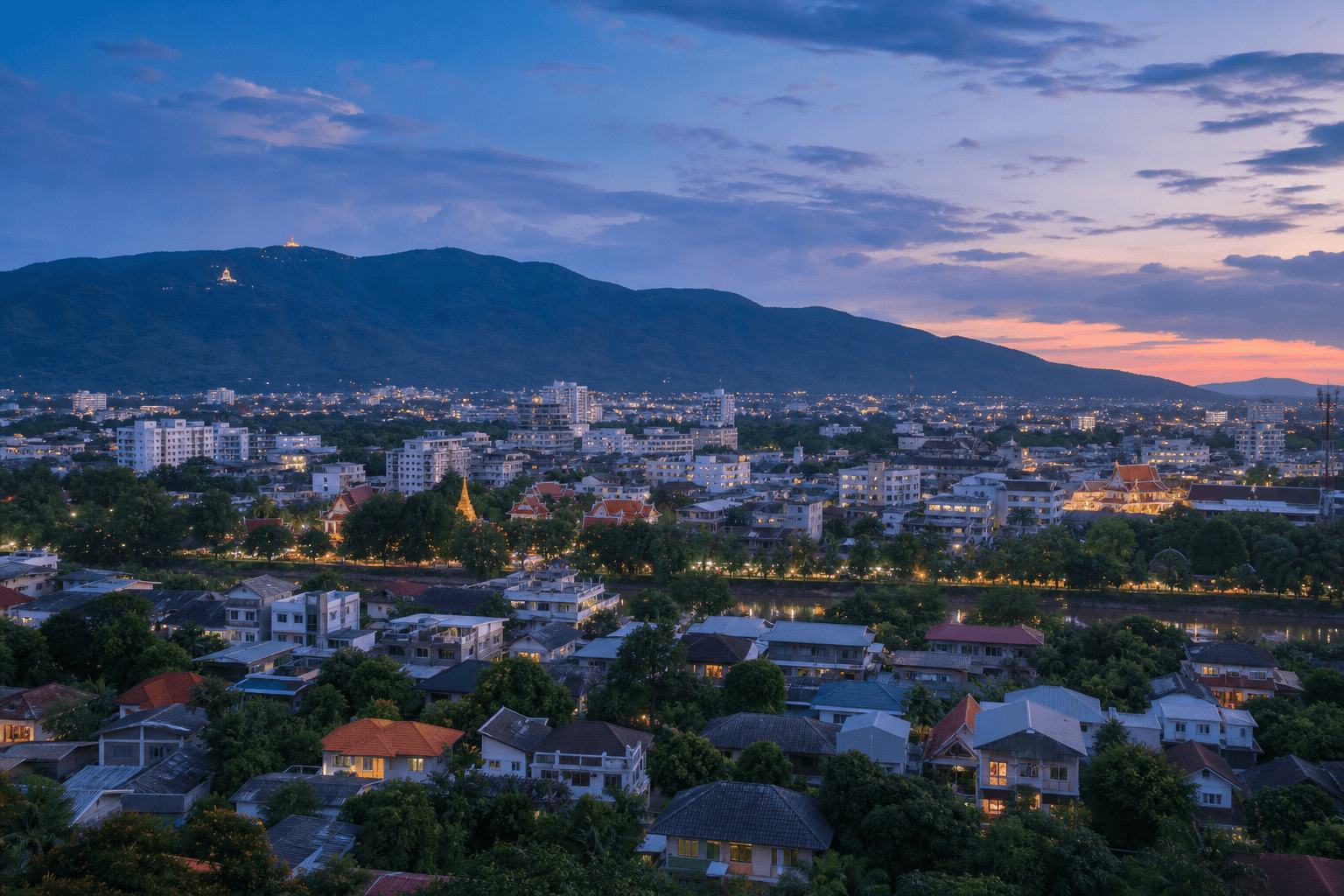 Chiang Mai at blue hour with Doi Suthep beyond the city